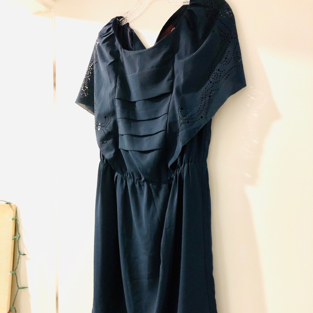 Above the knee boutique dress, laser cut details